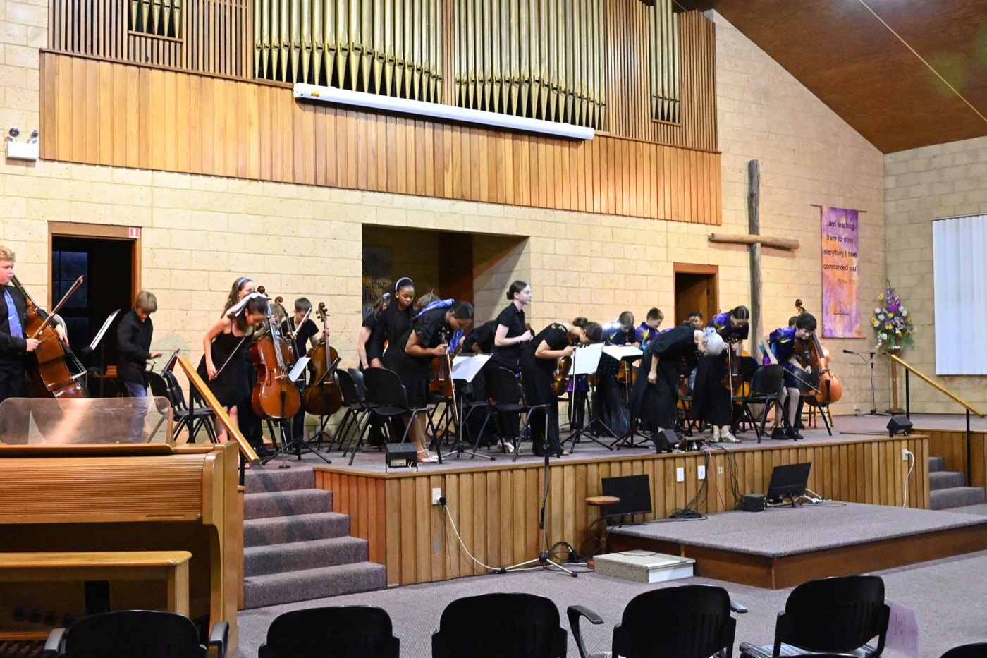 The orchestra taking a bow on stage after the 2025 concert.